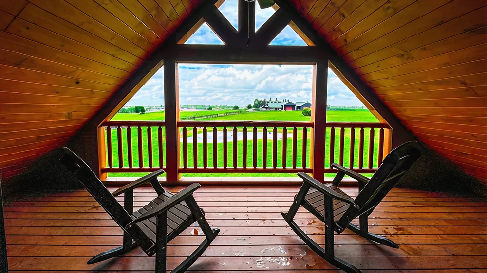Covered porch seating overlooking the Bluegrass pastures